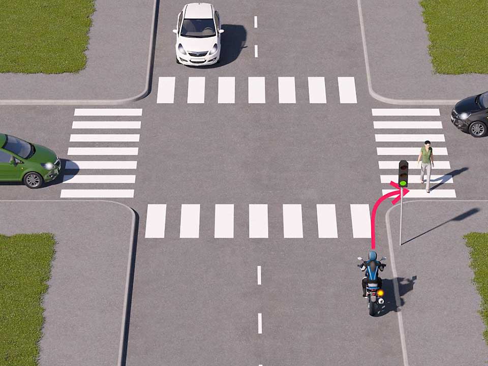 mallinnettu liikennetilanne, jossa moottoripyöräilijä lähestyy valo-risteystä