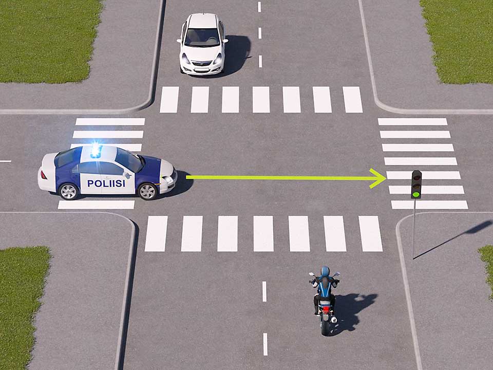 mallinnettu liikennetilanne; moottoripyöräilijä lähestyy risteystä, johon on tulossa hälytysajoneuvo