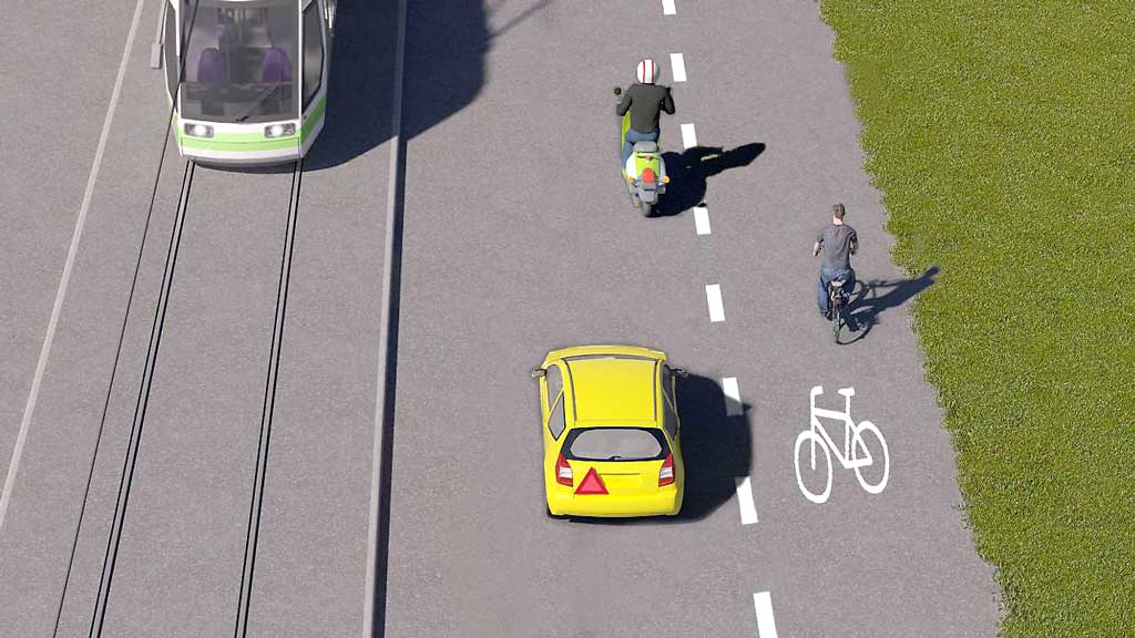 pyöräilijä pyöräkaistalla tien oikeassa reunassa